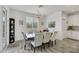 Bright dining room featuring a large table and six chairs at 7747 Harthill Park Ave, Las Vegas, NV 89113