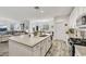 Open concept kitchen island with granite countertops at 7747 Harthill Park Ave, Las Vegas, NV 89113