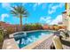 Resort-style pool and spa with patio seating at 7747 Harthill Park Ave, Las Vegas, NV 89113