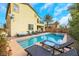 Relaxing pool area with lounge chairs and patio furniture at 7747 Harthill Park Ave, Las Vegas, NV 89113