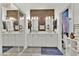 Double vanity bathroom with modern fixtures and a large mirror at 7868 Running Doe Ct, Las Vegas, NV 89149