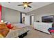 Bedroom featuring a ceiling fan, a dresser, and comfortable bedding at 7868 Running Doe Ct, Las Vegas, NV 89149