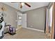 Bedroom with a view of the laundry room and modern ceiling fan at 7868 Running Doe Ct, Las Vegas, NV 89149