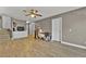 Living room with hardwood floors, ceiling fan, and access to upstairs at 7868 Running Doe Ct, Las Vegas, NV 89149