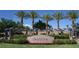 Silverstone Ranch entrance with palm trees and pergola at 8316 Broad Peak Dr, Las Vegas, NV 89131