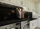 Clean laundry room, featuring white cabinets, LG washer and dryer, and granite countertop at 8316 Broad Peak Dr, Las Vegas, NV 89131