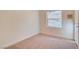 Bright bedroom with carpet flooring and a window at 8600 Kiel Ridge Cir, Las Vegas, NV 89117