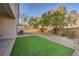 Landscaped backyard with artificial turf and a spacious area at 9178 Sunken Meadow Ave, Las Vegas, NV 89178