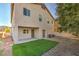 Home's backyard features artificial turf and a covered patio at 9178 Sunken Meadow Ave, Las Vegas, NV 89178