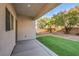 Private backyard with artificial turf and covered patio at 9178 Sunken Meadow Ave, Las Vegas, NV 89178