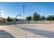 Outdoor basketball court with goals and ample space at 9178 Sunken Meadow Ave, Las Vegas, NV 89178