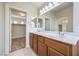 Double vanity bathroom with a walk-in closet at 9178 Sunken Meadow Ave, Las Vegas, NV 89178