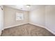 Bright bedroom with neutral walls and carpet at 9178 Sunken Meadow Ave, Las Vegas, NV 89178