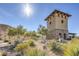 Gated community entrance with stone tower and landscaping at 9178 Sunken Meadow Ave, Las Vegas, NV 89178