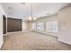 Open dining room with a view of the entryway and kitchen at 9178 Sunken Meadow Ave, Las Vegas, NV 89178