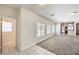 Clean entryway with tile flooring and access to living room and powder room at 9178 Sunken Meadow Ave, Las Vegas, NV 89178