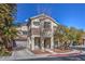 Two-story house with attached garage and landscaping at 9178 Sunken Meadow Ave, Las Vegas, NV 89178