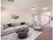 Living room with access to hallway and plenty of natural light at 9178 Sunken Meadow Ave, Las Vegas, NV 89178