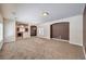 Spacious living room with large windows and neutral carpeting at 9178 Sunken Meadow Ave, Las Vegas, NV 89178