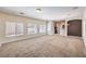 Bright and airy living room featuring neutral wall colors and carpet at 9178 Sunken Meadow Ave, Las Vegas, NV 89178