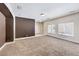 Open living room with a dramatic accent wall and ample natural light at 9178 Sunken Meadow Ave, Las Vegas, NV 89178