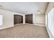 Bright living room featuring neutral walls and carpet at 9178 Sunken Meadow Ave, Las Vegas, NV 89178