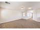 Spacious loft area with neutral carpeting and multiple windows at 9178 Sunken Meadow Ave, Las Vegas, NV 89178