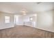 Spacious loft area with neutral carpeting and multiple windows at 9178 Sunken Meadow Ave, Las Vegas, NV 89178