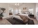 Main bedroom with ensuite bathroom and large windows at 9178 Sunken Meadow Ave, Las Vegas, NV 89178