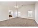 Main bedroom with high ceilings, chandelier, and ensuite bathroom at 9178 Sunken Meadow Ave, Las Vegas, NV 89178