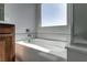 Bathroom featuring a bathtub and large window at 9217 Quartz Hills Ave, Las Vegas, NV 89178