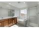 Bathroom with soaking tub, shower, and double vanity at 9217 Quartz Hills Ave, Las Vegas, NV 89178