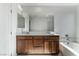 Bathroom with double vanity and soaking tub at 9217 Quartz Hills Ave, Las Vegas, NV 89178