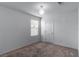 Bright bedroom with carpeted floor, large window, and neutral walls at 9217 Quartz Hills Ave, Las Vegas, NV 89178