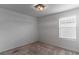 Well-lit bedroom with neutral walls and carpet at 9217 Quartz Hills Ave, Las Vegas, NV 89178