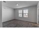 Bright bedroom with neutral walls and carpet at 9217 Quartz Hills Ave, Las Vegas, NV 89178