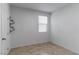 Bright bedroom with tile flooring and decorative wall shelves at 9217 Quartz Hills Ave, Las Vegas, NV 89178