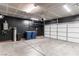 Attached garage with an automatic door opener, water softener, and extra space at 9217 Quartz Hills Ave, Las Vegas, NV 89178