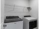 Laundry room with Whirlpool washer and dryer at 9217 Quartz Hills Ave, Las Vegas, NV 89178