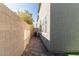 Side yard with brick pavement and a view of the home's exterior at 9217 Quartz Hills Ave, Las Vegas, NV 89178