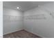 Spacious walk-in closet with ample shelving and hanging rods at 9217 Quartz Hills Ave, Las Vegas, NV 89178