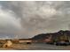 Scenic view of desert landscape with mountains and rainbow at 936 Elon Ln, Indian Springs, NV 89018