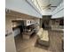 Kitchen and living area with laminate flooring and island at 936 Elon Ln, Indian Springs, NV 89018