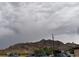 Image shows a mountain view with overcast sky at 936 Elon Ln, Indian Springs, NV 89018