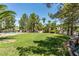 Landscaped backyard with grassy lawn at 2604 Sun Reef Rd, Las Vegas, NV 89128