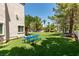 Large backyard with green grass, picnic table and desert landscape at , Las Vegas, NV 89128