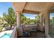 Outdoor balcony with chairs overlooking scenic landscape, pool and trees at 2604 Sun Reef Rd, Las Vegas, NV 89128