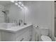 This bathroom features a glass enclosed shower, sink with vanity, mirrored wall and adjacent toilet at , Las Vegas, NV 89128