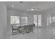 Bright dining room features glass table, gray chairs, and access to backyard at , Las Vegas, NV 89128