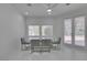 Dining area featuring a glass table, seating for four, and natural light at 2604 Sun Reef Rd, Las Vegas, NV 89128